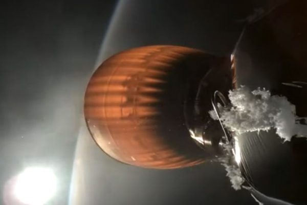 Screenshot from the webcast of a SpaceX Starlink launch on July 11, 2024, showing a buildup of white material on the upper stage of a Falcon 9 rocket.